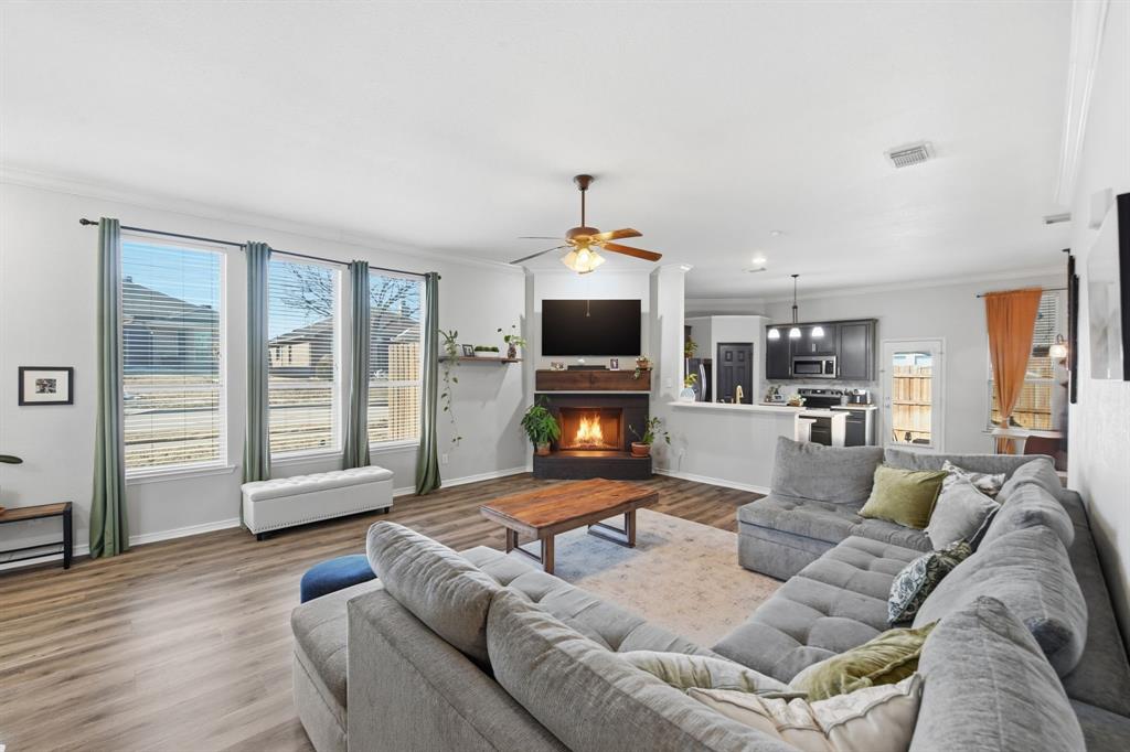 a living room with furniture window and flat screen tv