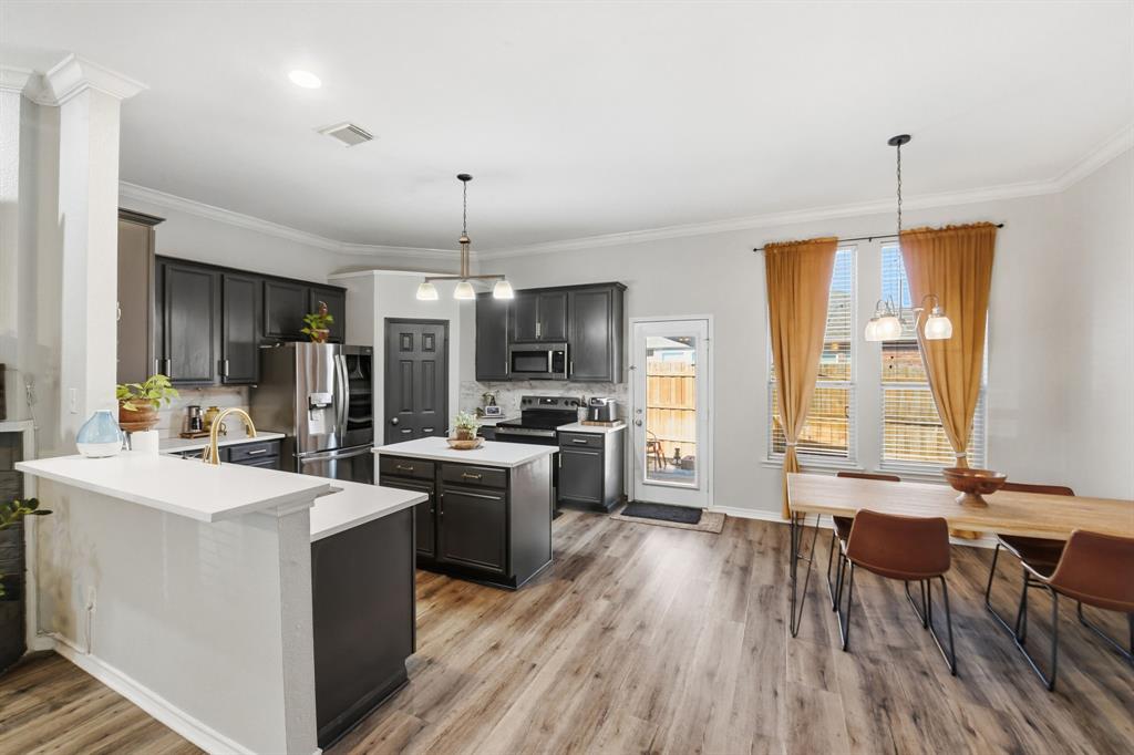 3701 Fiscal Court Fort Worth, TX 76244 - Photo 12 of 29 a large kitchen with a table and chairs