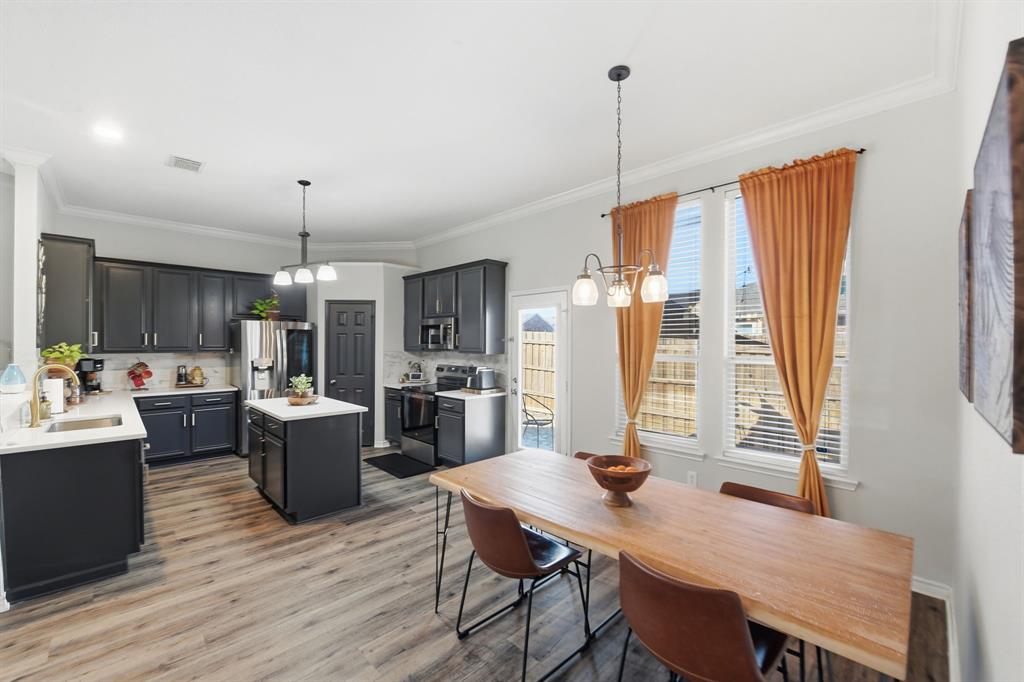 3701 Fiscal Court Fort Worth, TX 76244 - Photo 14 of 29 a view of a dining room with furniture window and wooden floor
