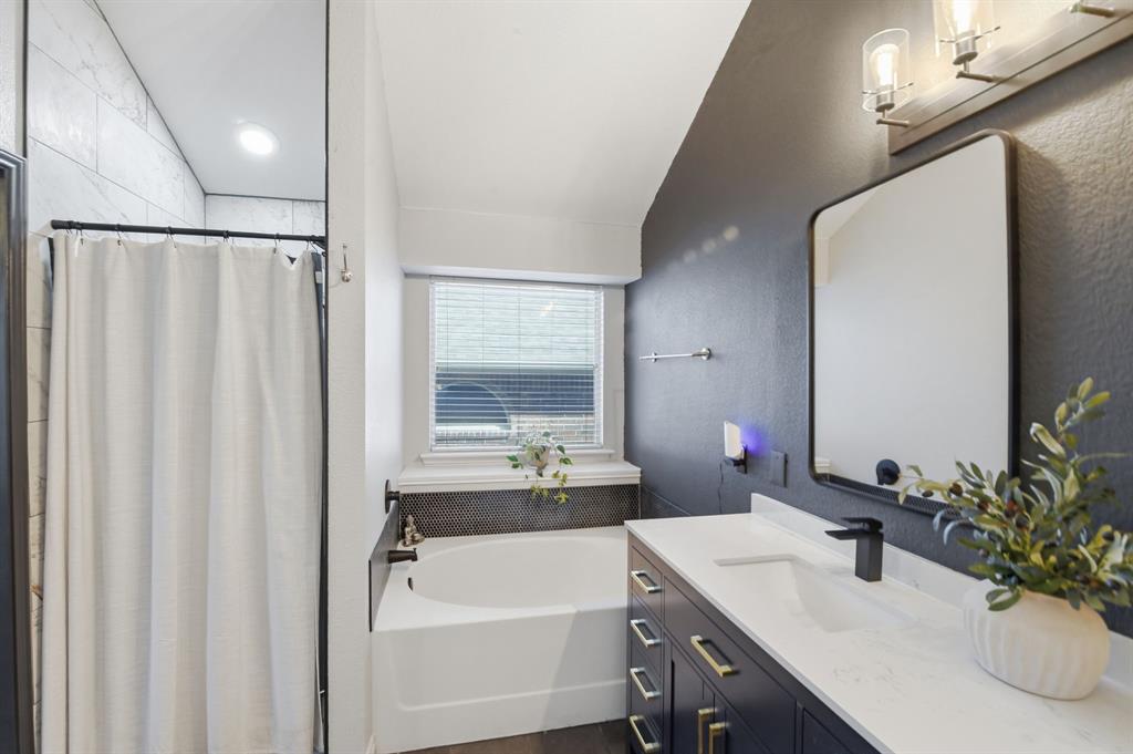 3701 Fiscal Court Fort Worth, TX 76244 - Photo 18 of 29 a bathroom with a double vanity sink a mirror and a shower