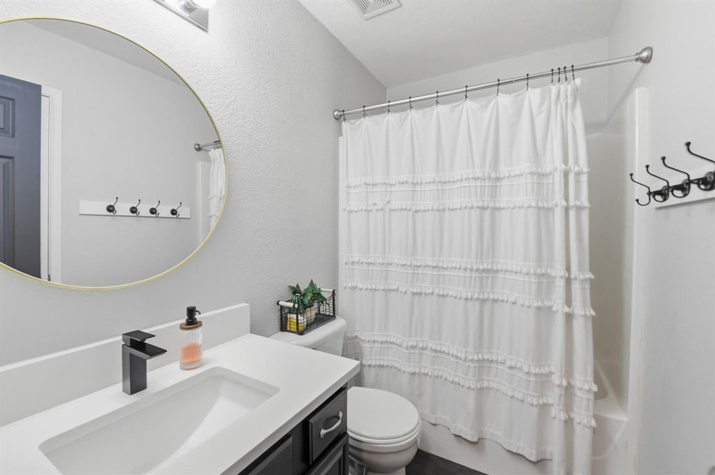 3701 Fiscal Court Fort Worth, TX 76244 - Photo 21 of 29 a bathroom with a sink and a mirror