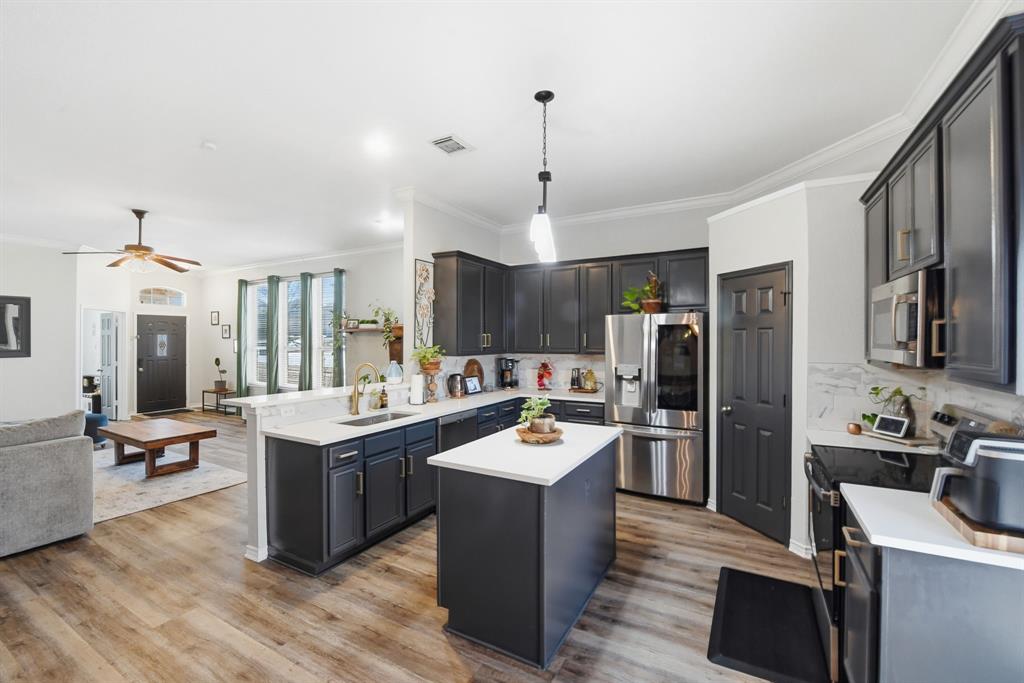 3701 Fiscal Court Fort Worth, TX 76244 - Photo 10 of 29 a kitchen with a sink stove and refrigerator