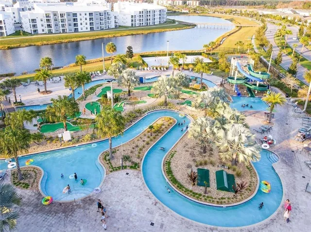 a view of a swimming pool with lounge chairs