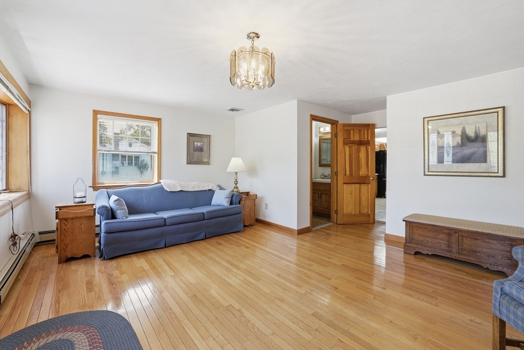 7 Swift Avenue Wareham, MA 02571 - Photo 4 of 42 a living room with furniture and a chandelier