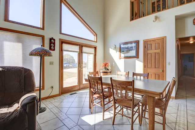 a living room with furniture a rug and a window