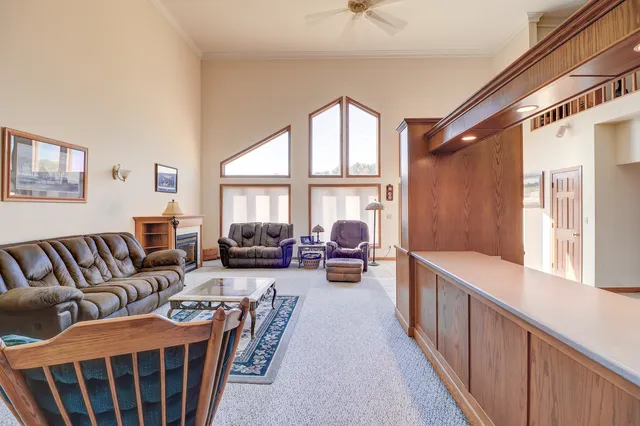 a living room with furniture and a fireplace