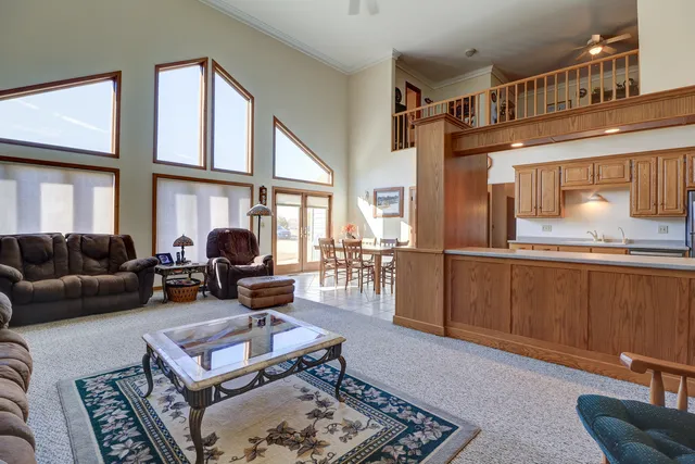 a living room with furniture a fireplace and a window