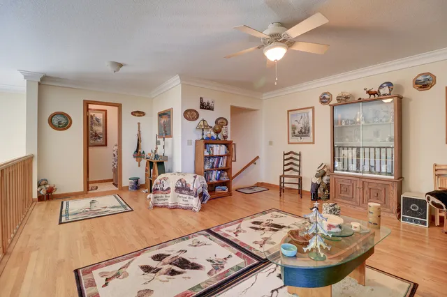 a view of a bedroom with a bed and a mirror