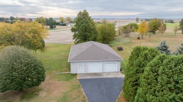 an aerial view of a house with outdoor space
