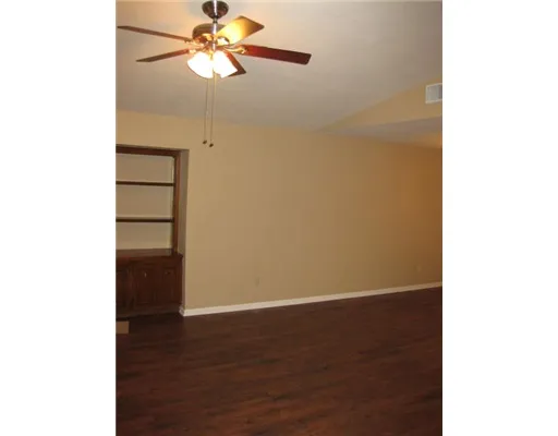 a view of a room with a wooden floor
