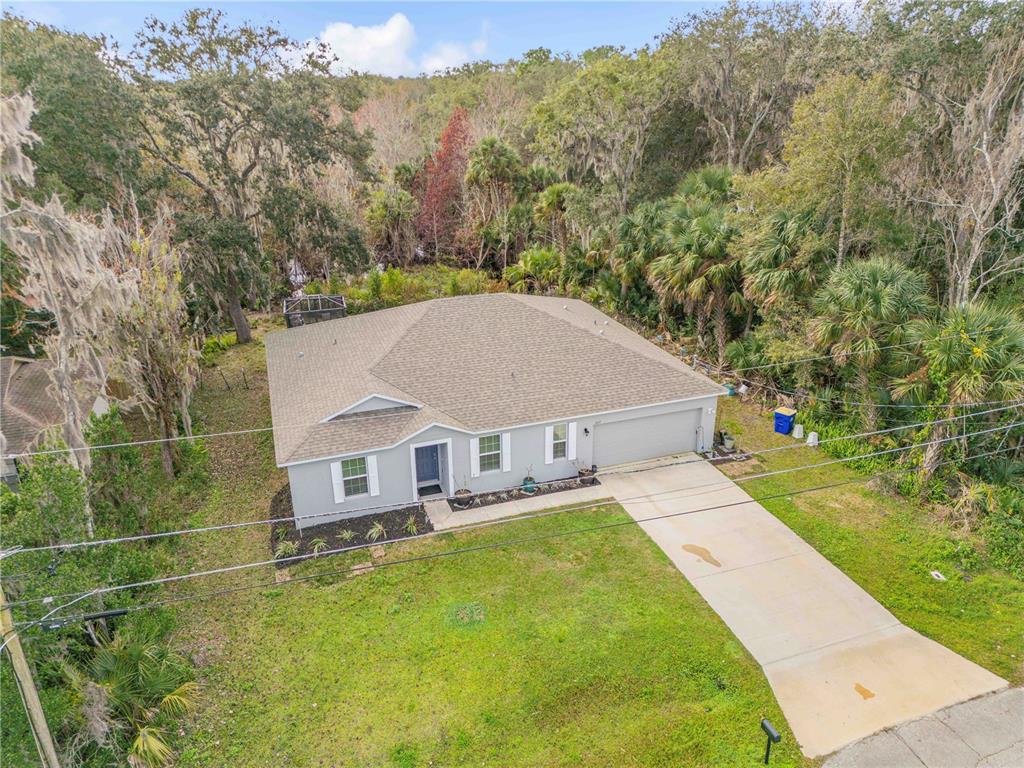 1017 36th Street Edgewater, FL 32141 - Photo 2 of 29 a view of a house with pool and a yard