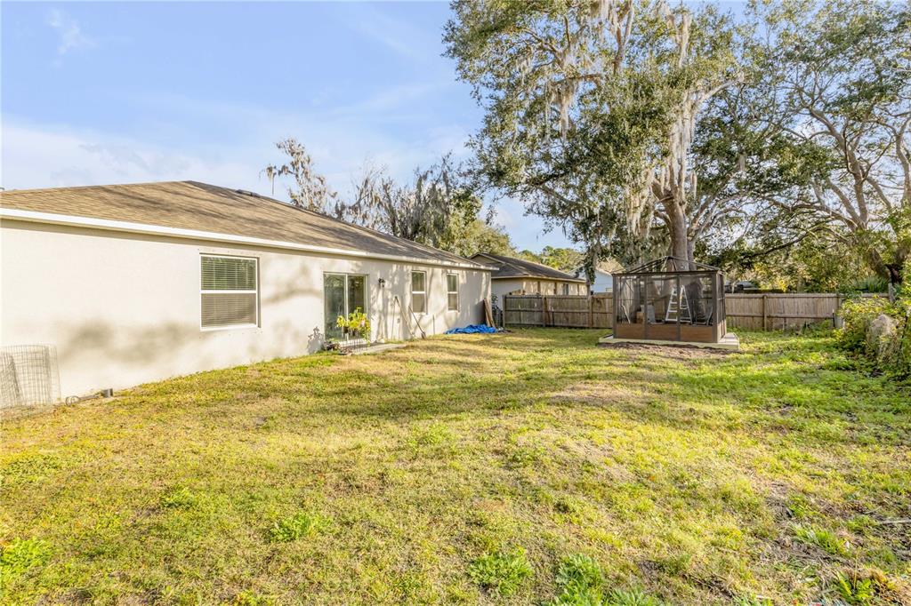 1017 36th Street Edgewater, FL 32141 - Photo 21 of 29 a front view of a house with a garden