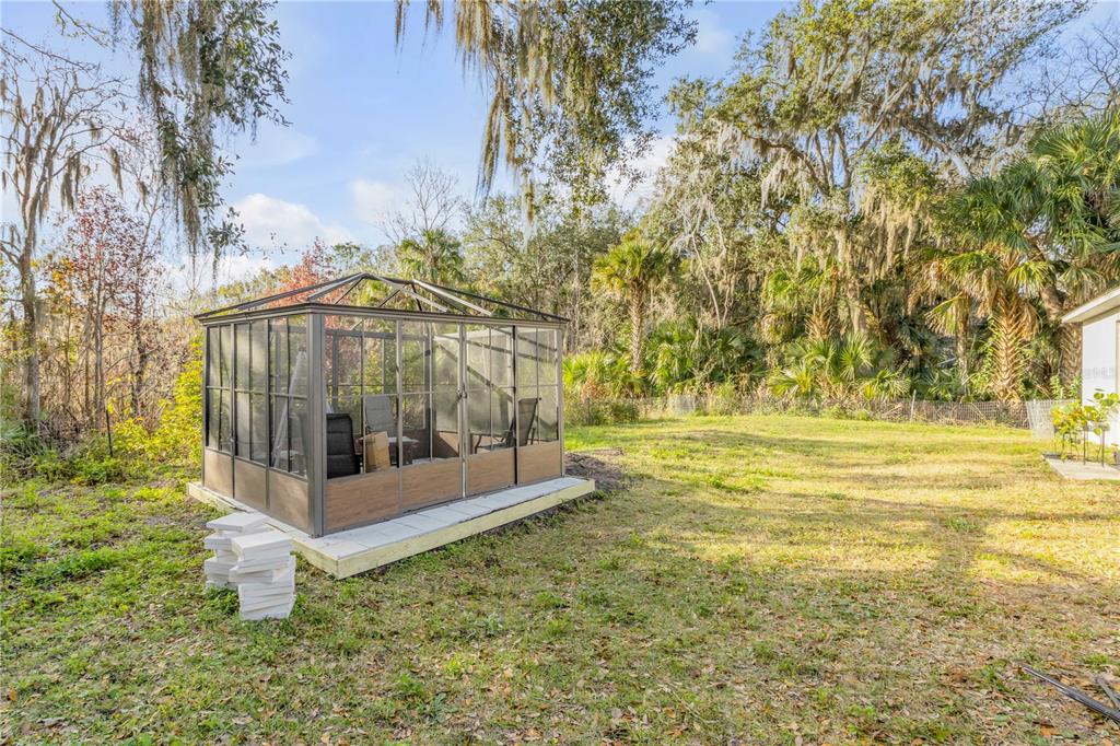 1017 36th Street Edgewater, FL 32141 - Photo 22 of 29 a view of a yard with an trees