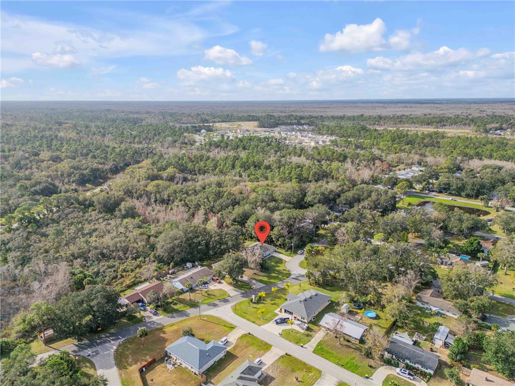 1017 36th Street Edgewater, FL 32141 - Photo 26 of 29 an aerial view of a houses with city view