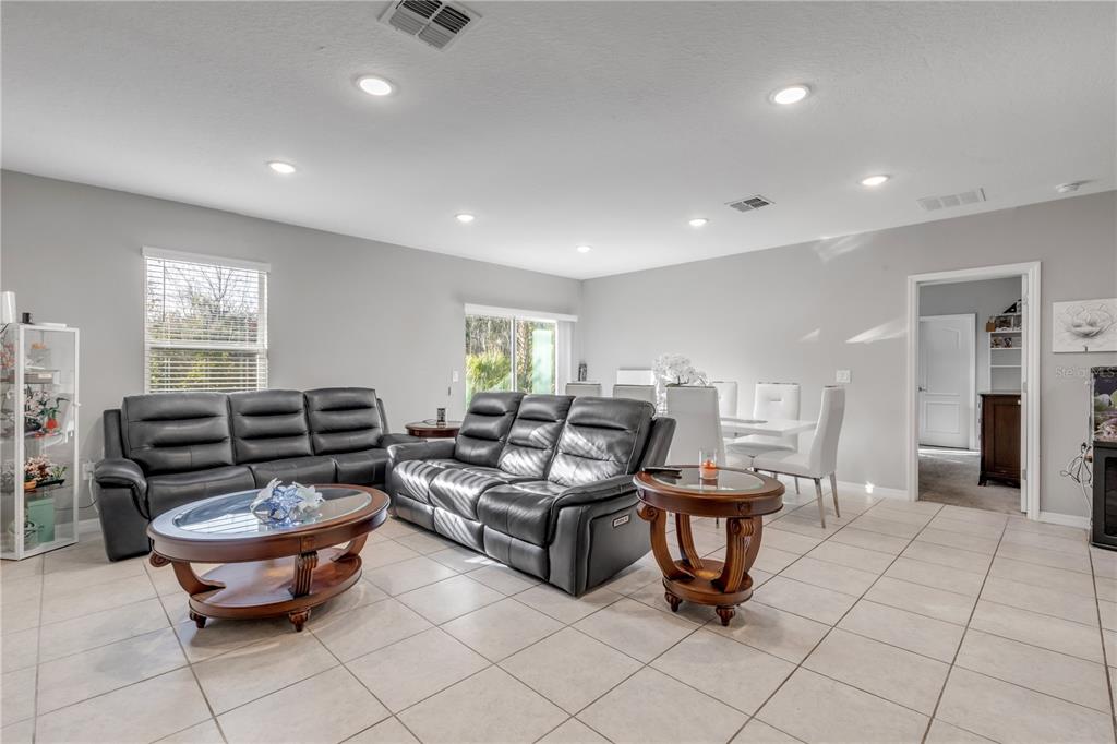 1017 36th Street Edgewater, FL 32141 - Photo 9 of 29 a living room with furniture a window and a fireplace
