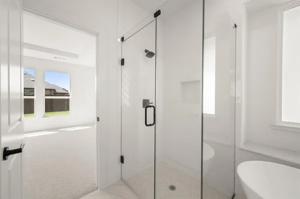 a kitchen with stainless steel appliances kitchen island granite countertop a table and chairs in it
