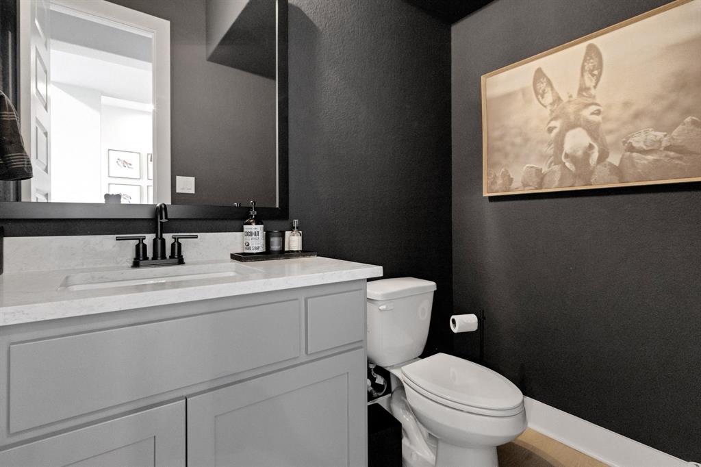 325 Cumberland Cove Georgetown, TX 78628 - Photo 15 of 39 a bathroom with a toilet sink vanity and mirror