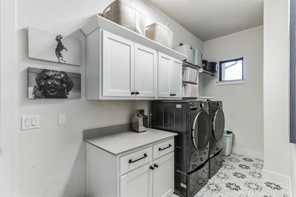 325 Cumberland Cove Georgetown, TX 78628 - Photo 20 of 39 a utility room with cabinets
