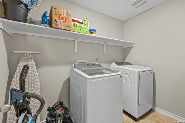 a utility room with dryer and washer