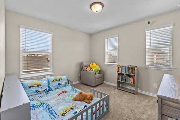 a bedroom with furniture and window