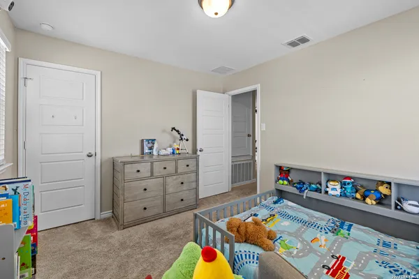 a room with toys and a dresser
