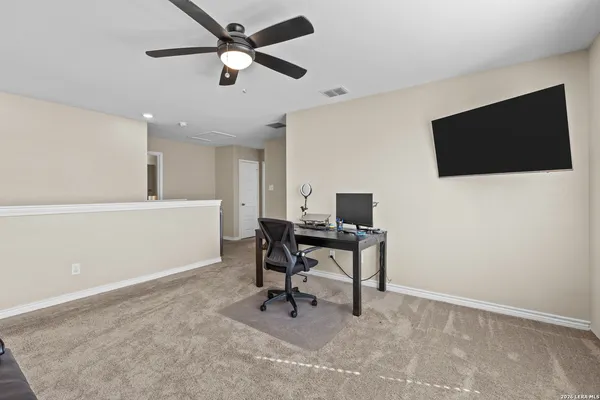 a view of a workspace with furniture