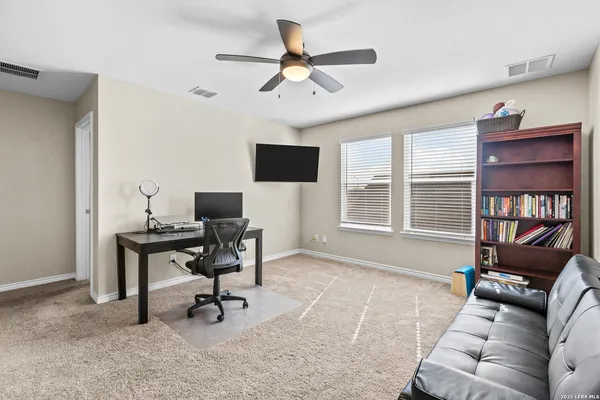 a workspace with furniture and a window