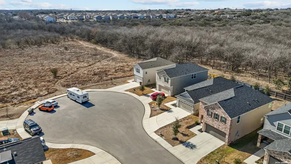 an aerial view of a house with outdoor space