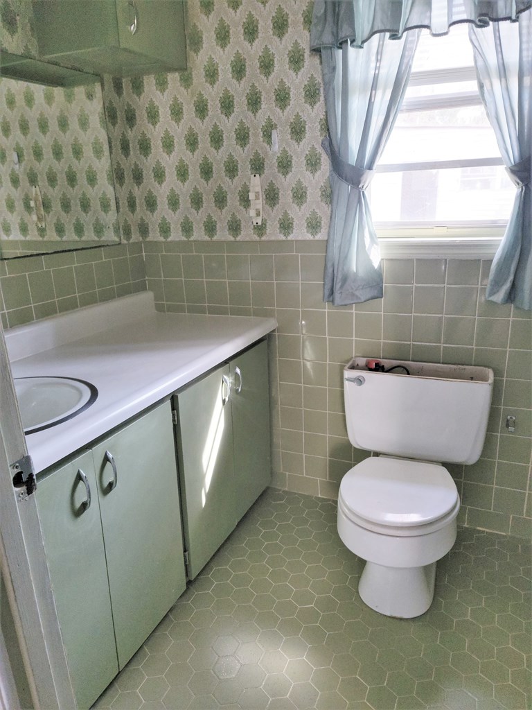 2855 Barbara Road Columbus, GA 31907 - Photo 14 of 17 a bathroom with a toilet and a mirror