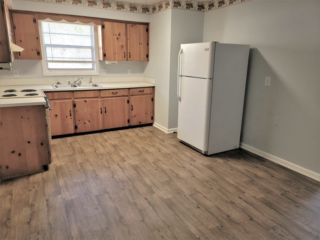2855 Barbara Road Columbus, GA 31907 - Photo 3 of 17 a kitchen with a refrigerator sink stove and cabinets