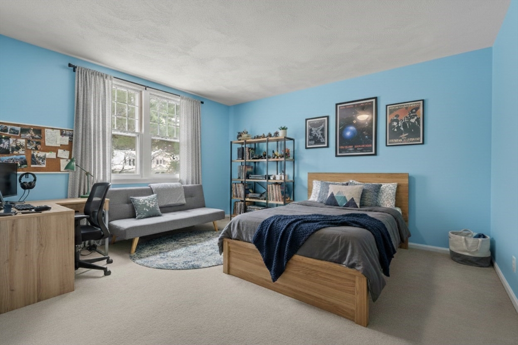 173 Conant Road Weston, MA 02493 - Photo 21 of 25 a bedroom with a bed and a couch