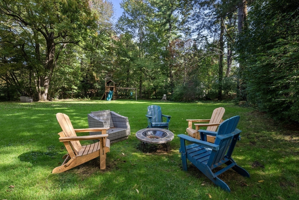173 Conant Road Weston, MA 02493 - Photo 24 of 25 a garden view with a sitting space garden view and trees
