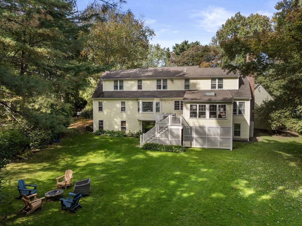 173 Conant Road Weston, MA 02493 - Photo 3 of 25 a house view with a sitting space and garden