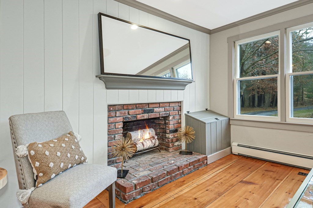 30 Nourse Road Bolton, MA 01740 - Photo 16 of 40 a living room with furniture and a fireplace