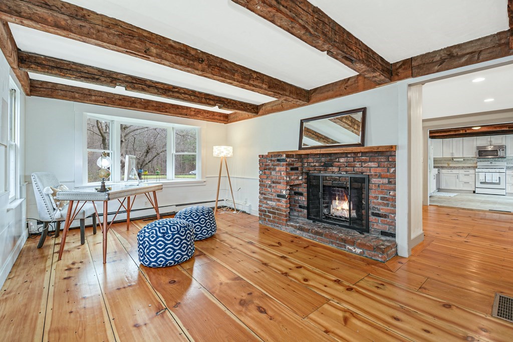 30 Nourse Road Bolton, MA 01740 - Photo 19 of 40 a living room with furniture and a fireplace