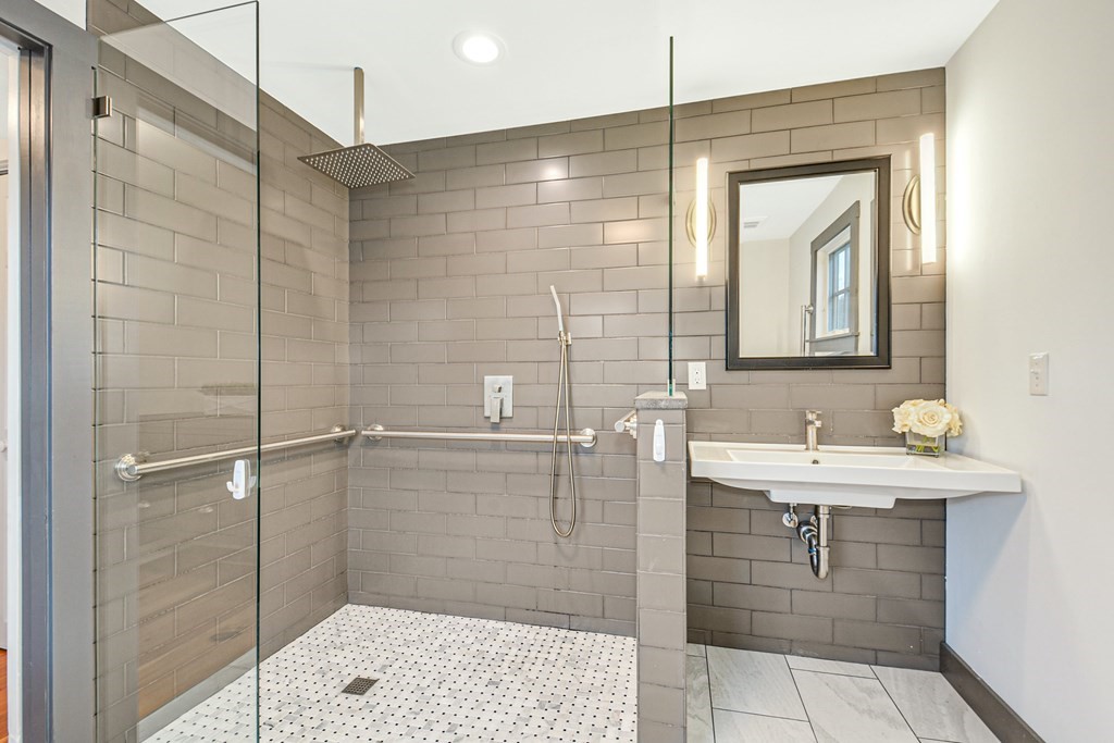 30 Nourse Road Bolton, MA 01740 - Photo 24 of 40 a bathroom with a shower sink and mirror