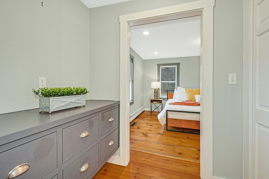 30 Nourse Road Bolton, MA 01740 - Photo 25 of 40 a living room with furniture and a potted plant