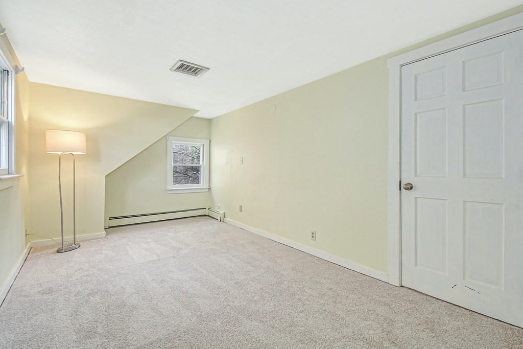 30 Nourse Road Bolton, MA 01740 - Photo 27 of 40 an empty room with windows and closet