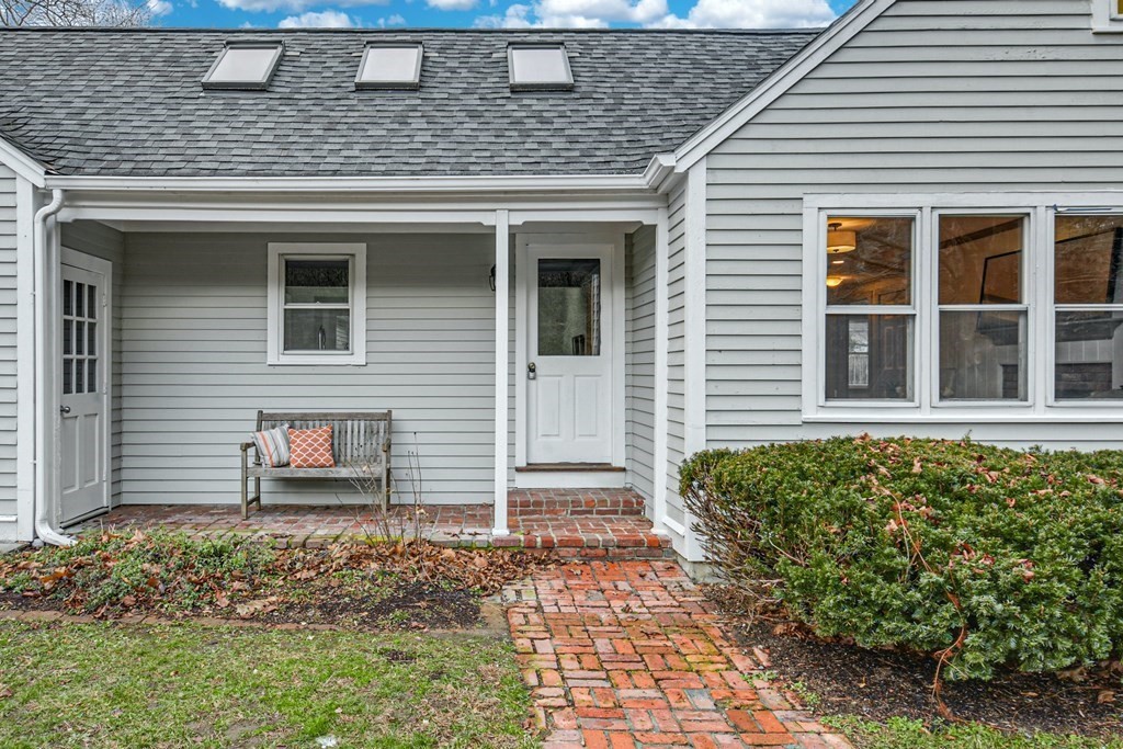 30 Nourse Road Bolton, MA 01740 - Photo 3 of 40 a front view of a house with garden