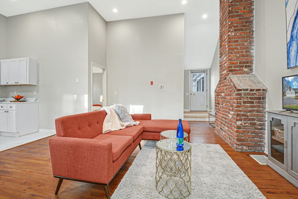 30 Nourse Road Bolton, MA 01740 - Photo 37 of 40 a living room with furniture and a table