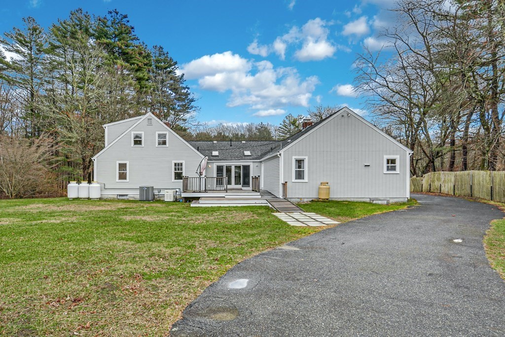 30 Nourse Road Bolton, MA 01740 - Photo 7 of 40 a view of a white house with a yard