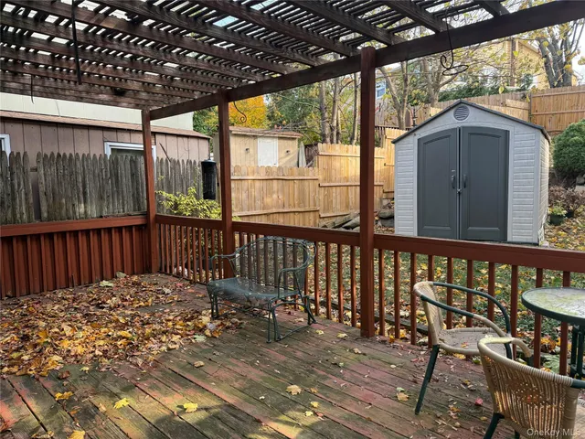 a view of a two chairs in the balcony