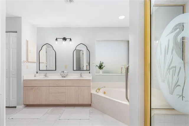 a bedroom with a bed and a television