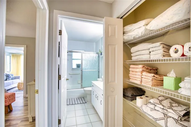 a bedroom with a bed and a table