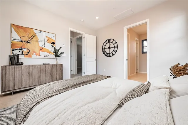 an empty room with closet and a bathroom