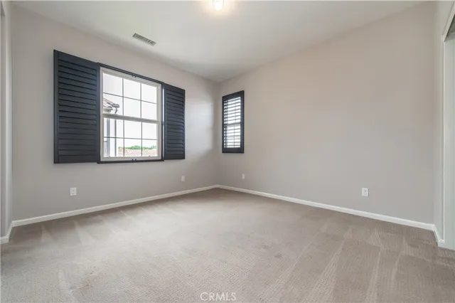 a bedroom with a bed and a walk in closet