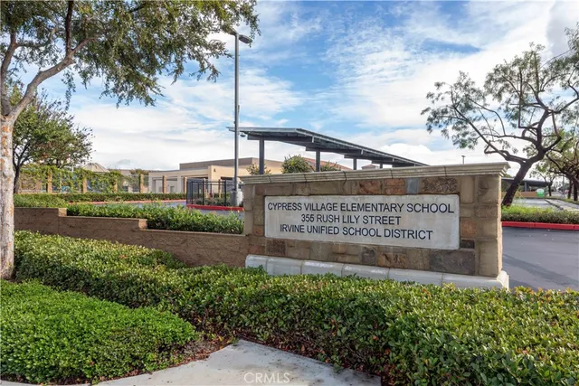 an aerial view of a house with garden space and lake view