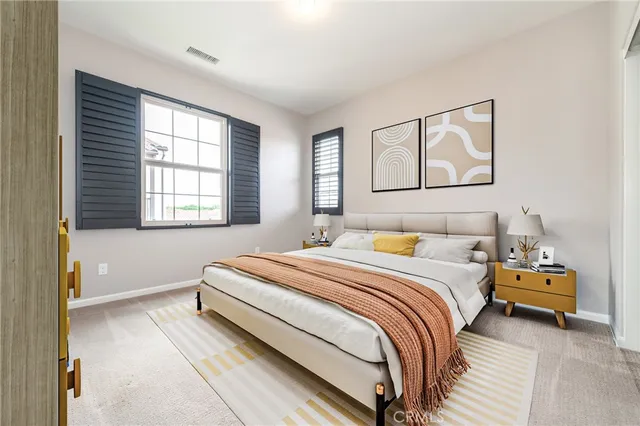 a balcony with furniture and a potted plant