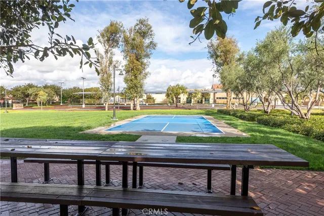 an aerial view of a house with a yard and lake view