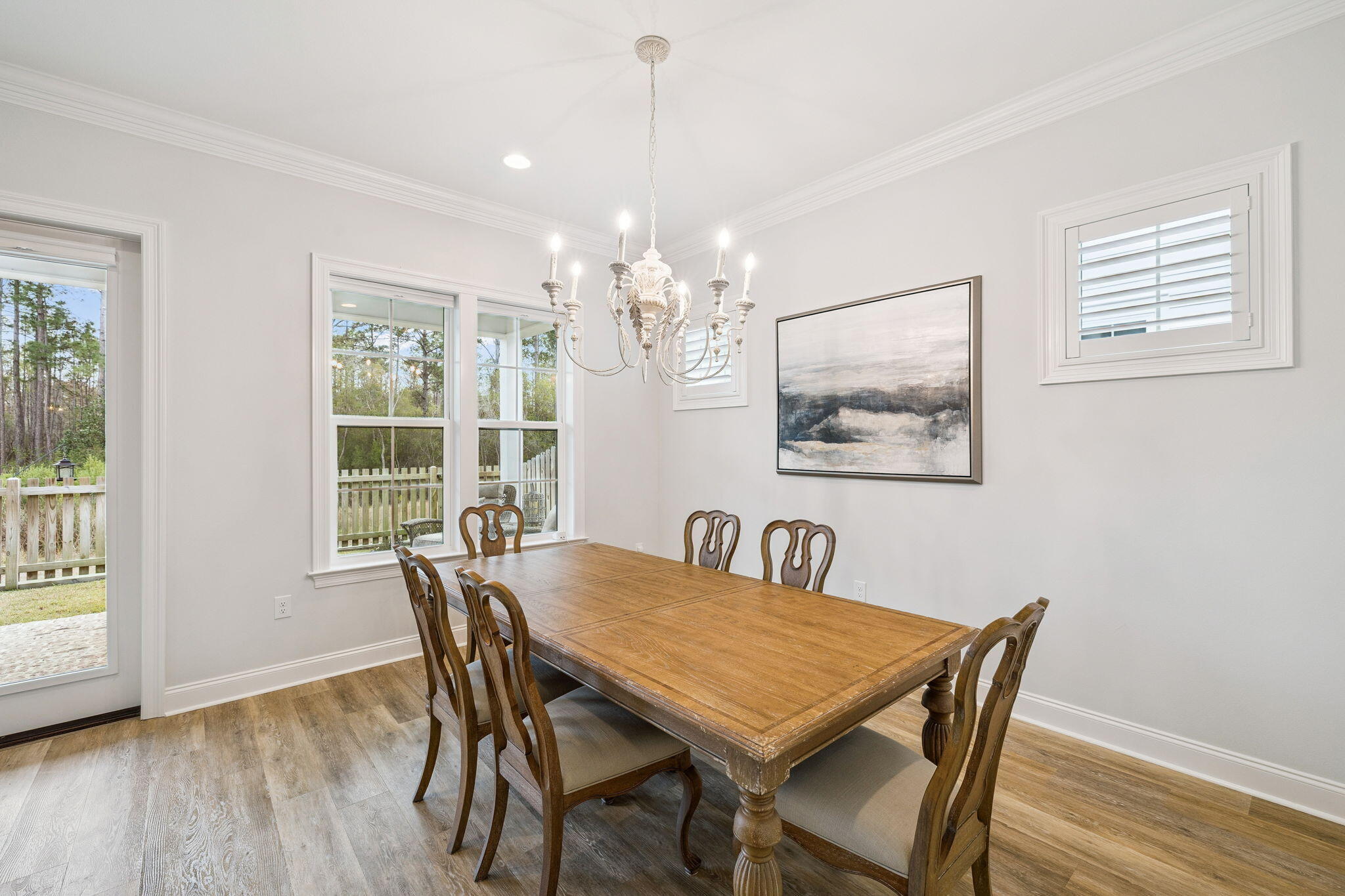 129 Suwannee Dr Inlet Beach Inlet Beach, FL 32461 - Photo 16 of 43 a view of a dining room with furniture wooden floor and chandelier